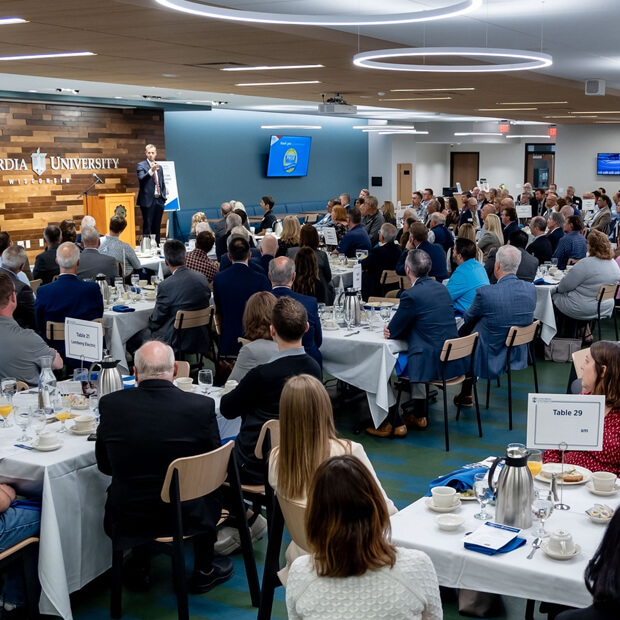 Attendees eagerly listen to guest speaker in CUW’s dining hall.